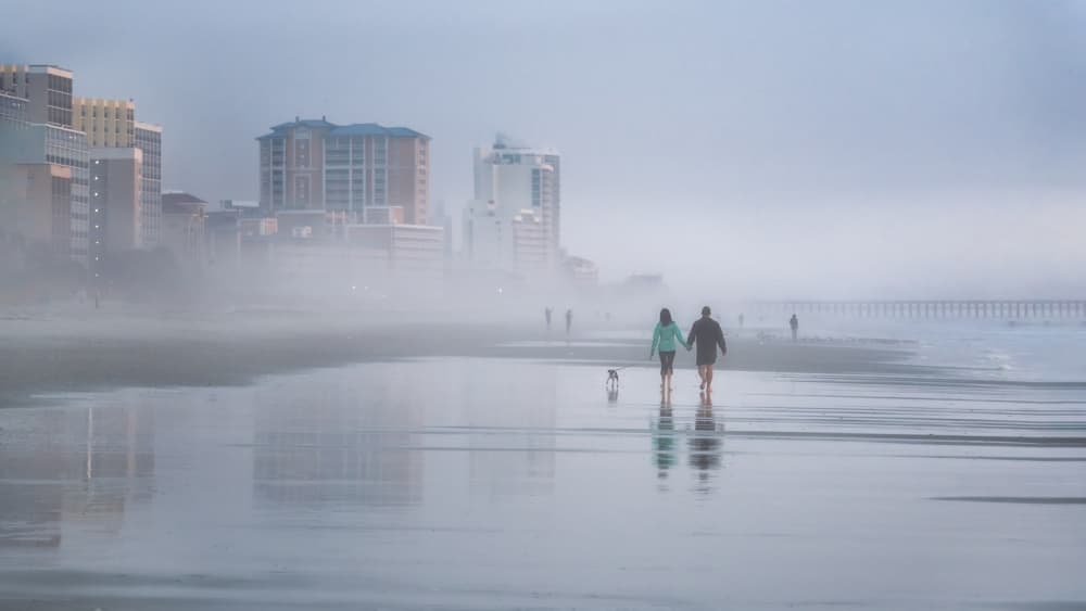 Misty Beach Walk by Jianping Yang — canvas wall art