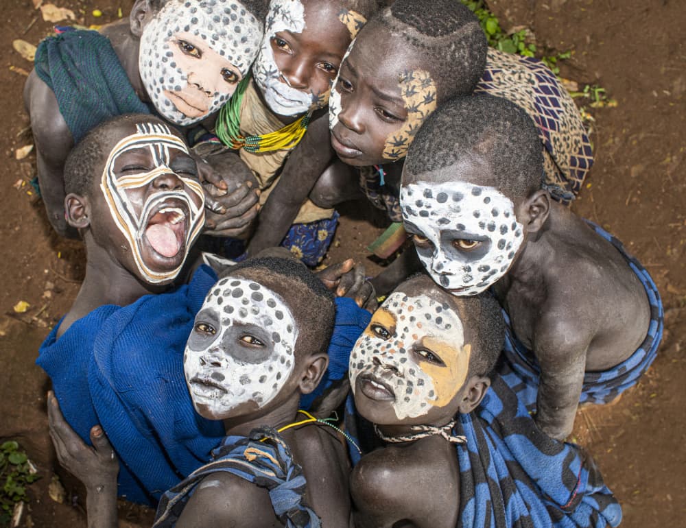 African Kids Face Paint by Iris Wiener — canvas wall art