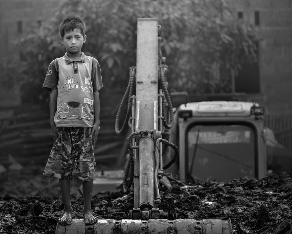 Serious Boy on Excavator by Fahmi Bhs — canvas wall art