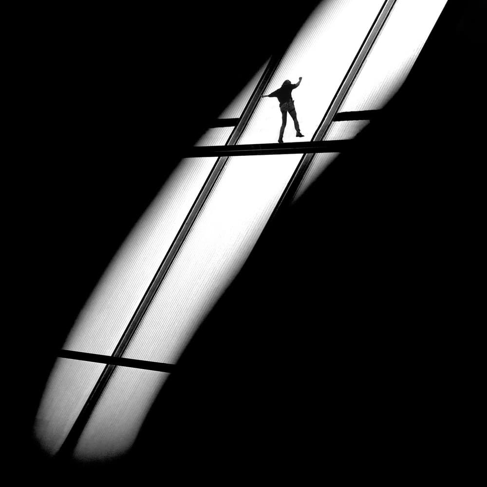 Balancing Figure on Light by Huib Limberg — canvas wall art