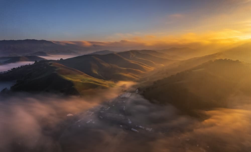 Misty Mountain Sunrise by Jenny Qiu — canvas wall art