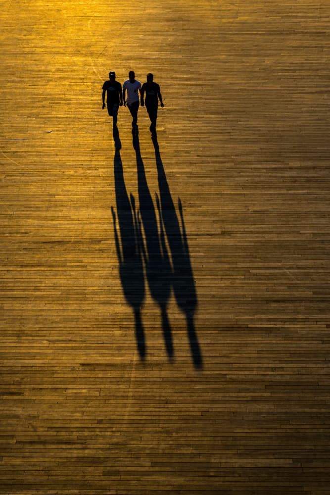 Three Figures Golden Hour by Yavuz Pancareken — canvas wall art