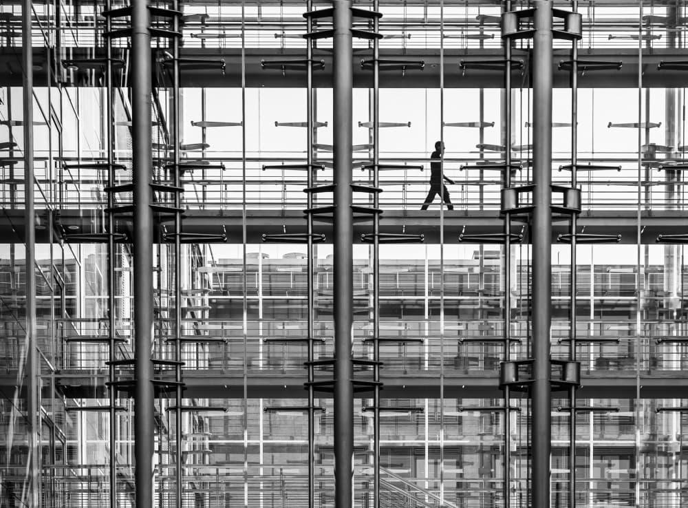 Man Walks Modern Architecture by Anna Niemiec — canvas wall art