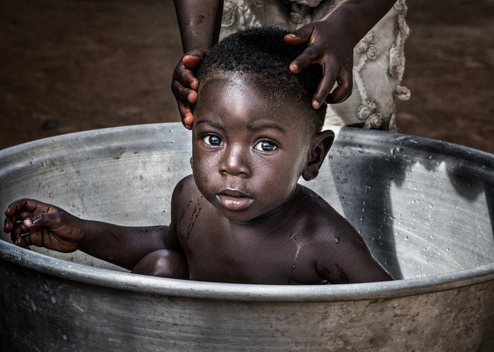Gentle Child's Bath by Joxe Inazio Kuesta Garmendia — canvas wall art