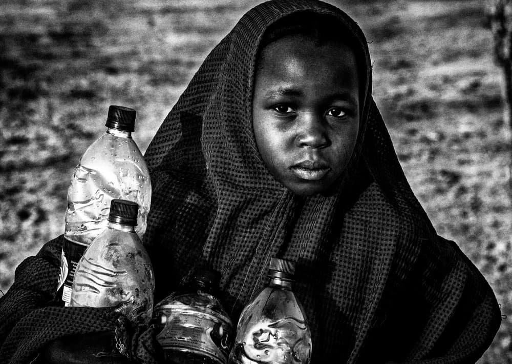 Gazing Girl With Bottles by Joxe Inazio Kuesta Garmendia — canvas wall art