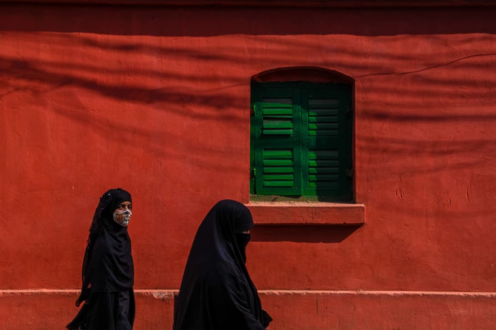 Veiled Women Red Wall by Kuntal Biswas — canvas wall art