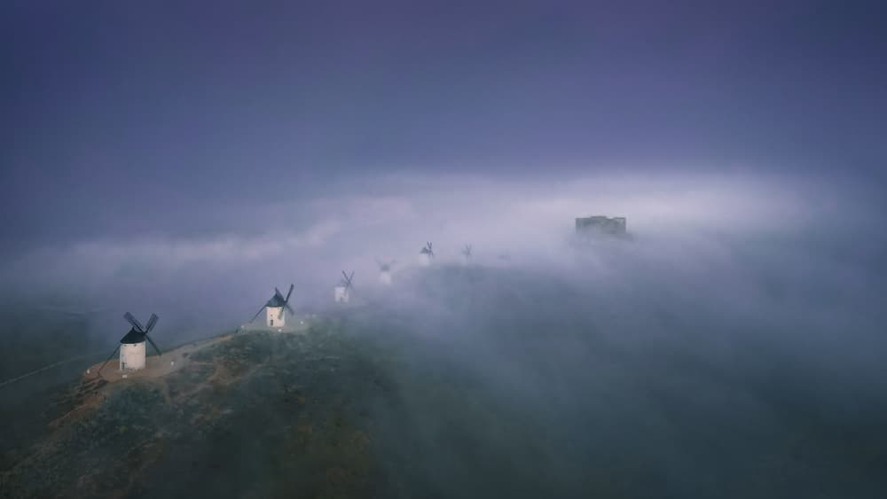 Misty Spanish Windmills by Enrique Rodriguez de Mingo — canvas wall art