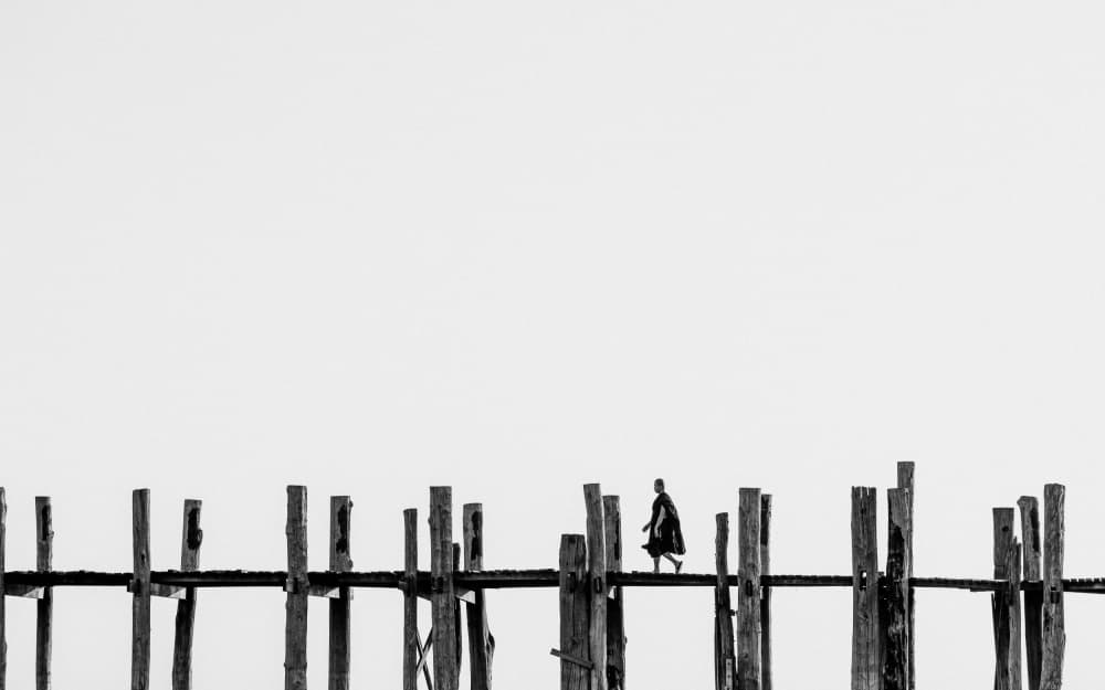 Monk on Wooden Bridge by ADIREK M — canvas wall art
