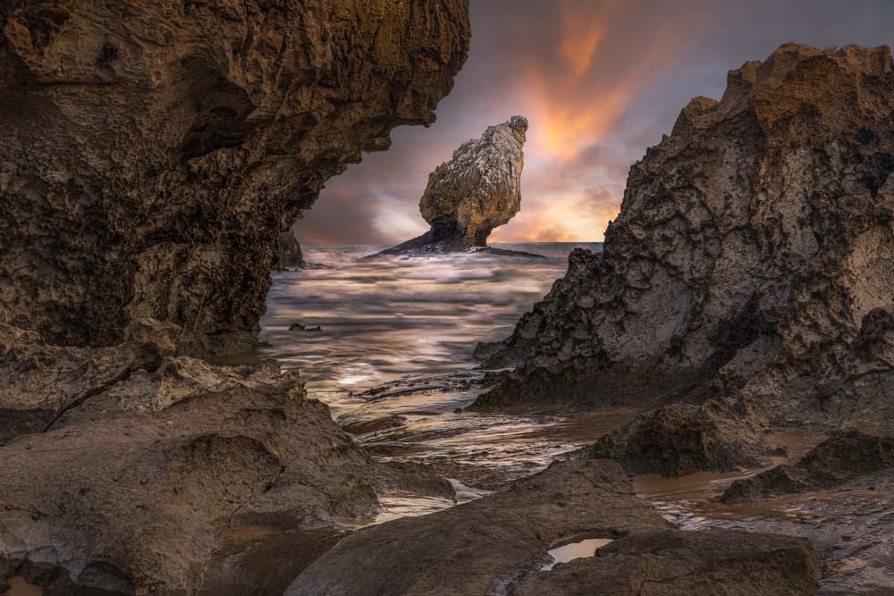 Dramatic Coastal Sunset by Juan I. Cuadrado — canvas wall art