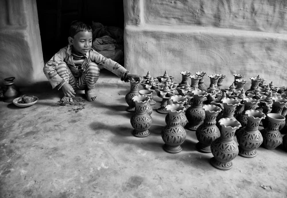 Young Potter at Work by Avishek Das — canvas wall art