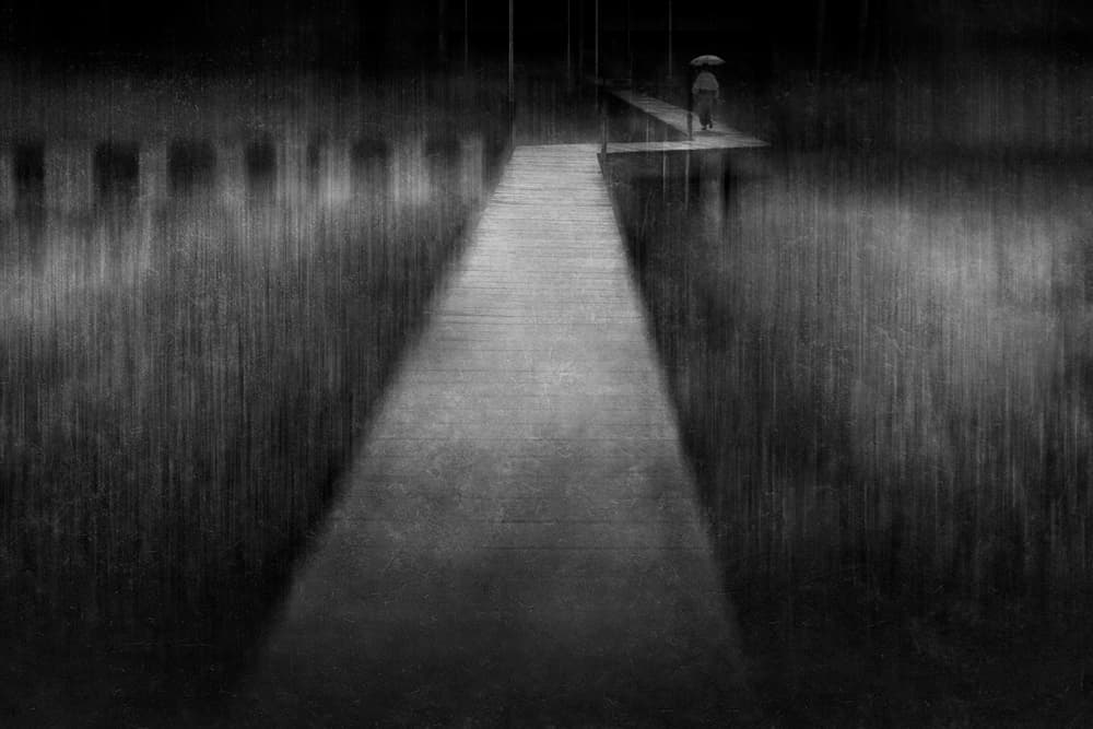 Lone Figure Rainy Pier by Ekkachai Khemkum — canvas wall art