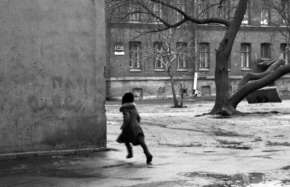 Child Running City Courtyard by Dieter Matthes — canvas wall art
