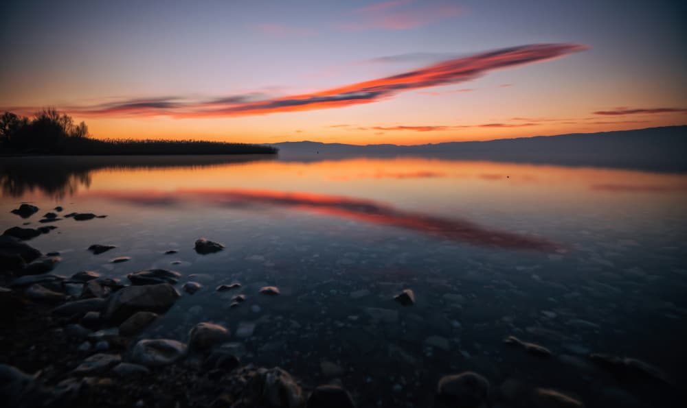 Vibrant Sunset Reflections by Merthan Kortan — canvas wall art