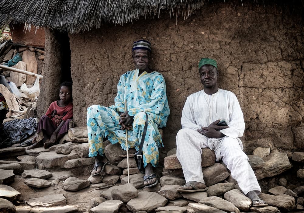 Village Men and Child by Elena Molina — canvas wall art