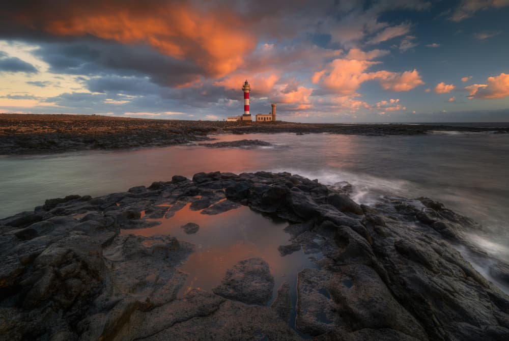 Lighthouse Sunset Reflection by Adam Pachula — canvas wall art