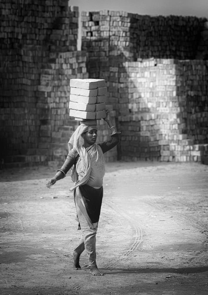 Woman Carrying Bricks by Garik — canvas wall art