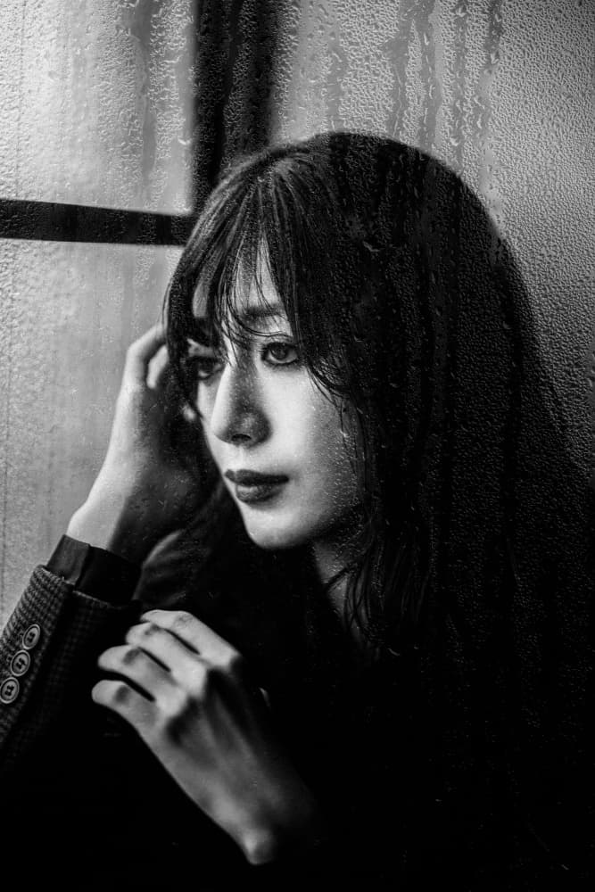 Pensive Woman Rainy Window by Yuzo Fujii — canvas wall art