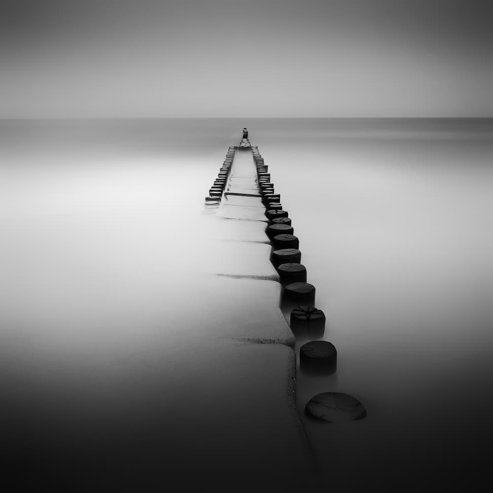 Solitary Figure on Pier by Daniel Řeřicha — canvas wall art