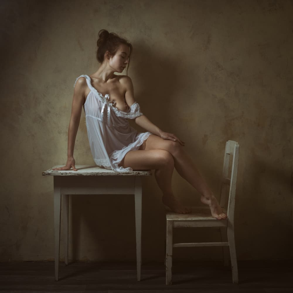 Pensive Woman in White by Ruth Franke — canvas wall art
