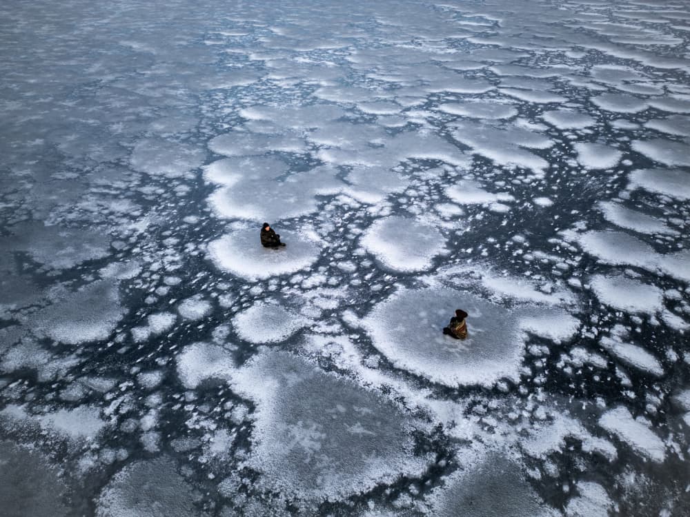 Solitary Ice Fishing by Leszek Paradowski — canvas wall art