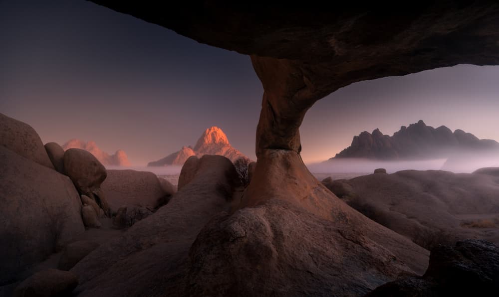 Misty Desert Arch Sunrise by Karol Nienartowicz — canvas wall art
