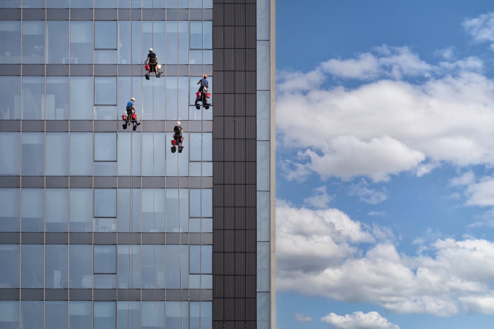 Skyscraper Window Washers by Jurij Bizjak — canvas wall art