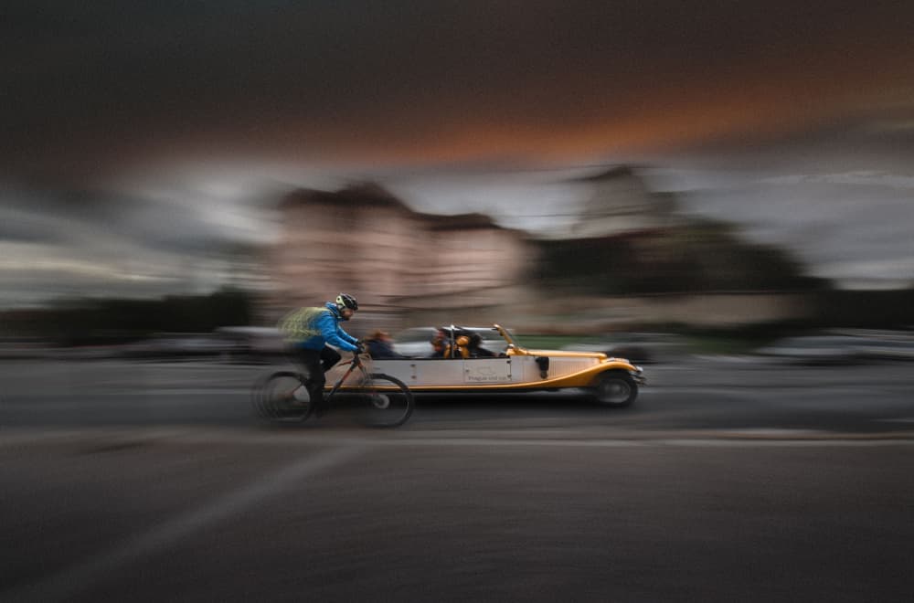 Speeding Cyclist Classic Car by Larry Deng APA — canvas wall art