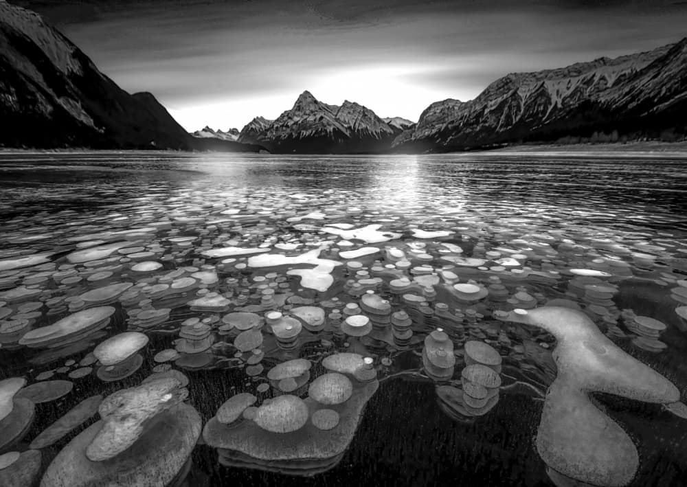 Mountain Lake Ice Bubbles by Jiahong Zeng — canvas wall art