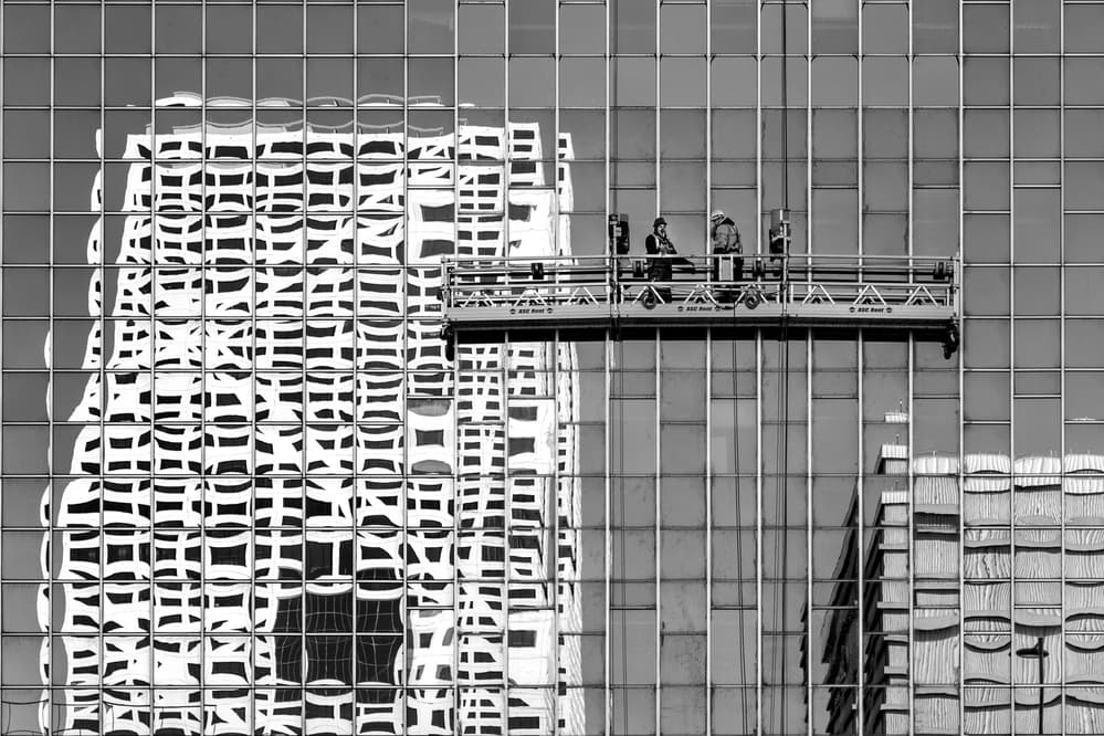 Skyscraper Reflections And Workers by Theo Luycx — canvas wall art
