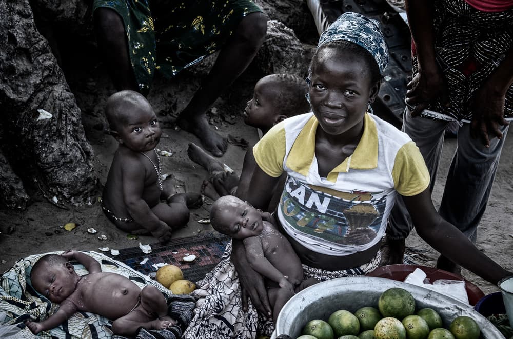 African Market Family by Joxe Inazio Kuesta Garmendia — canvas wall art