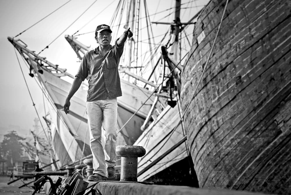 Harbor Man Directs Ships by Hengki Lee — canvas wall art