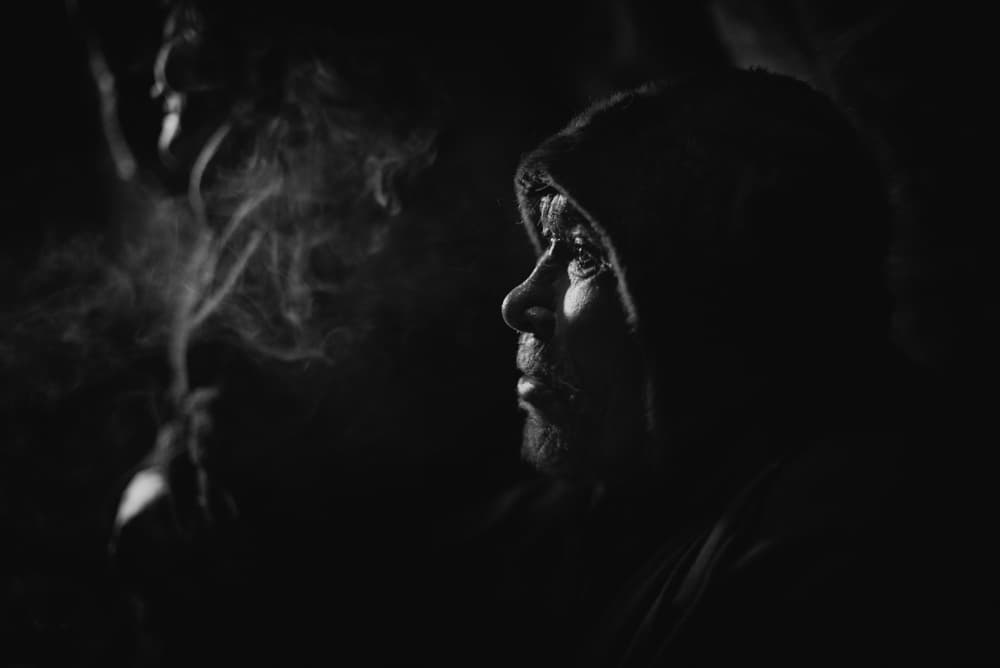 Hooded Man In Smoke by Andrey Snegirev — canvas wall art