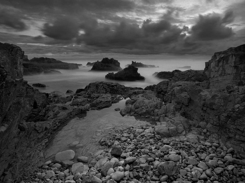 Moody Ocean Rocks by Nana Sousa Dias — canvas wall art