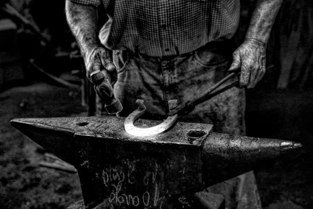 Blacksmith Forging Horseshoe by Paulo Medeiros — canvas wall art