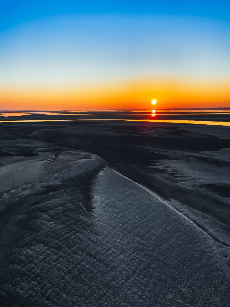 Sunset Over Tidal Flats by Ryan Braxton — canvas wall art