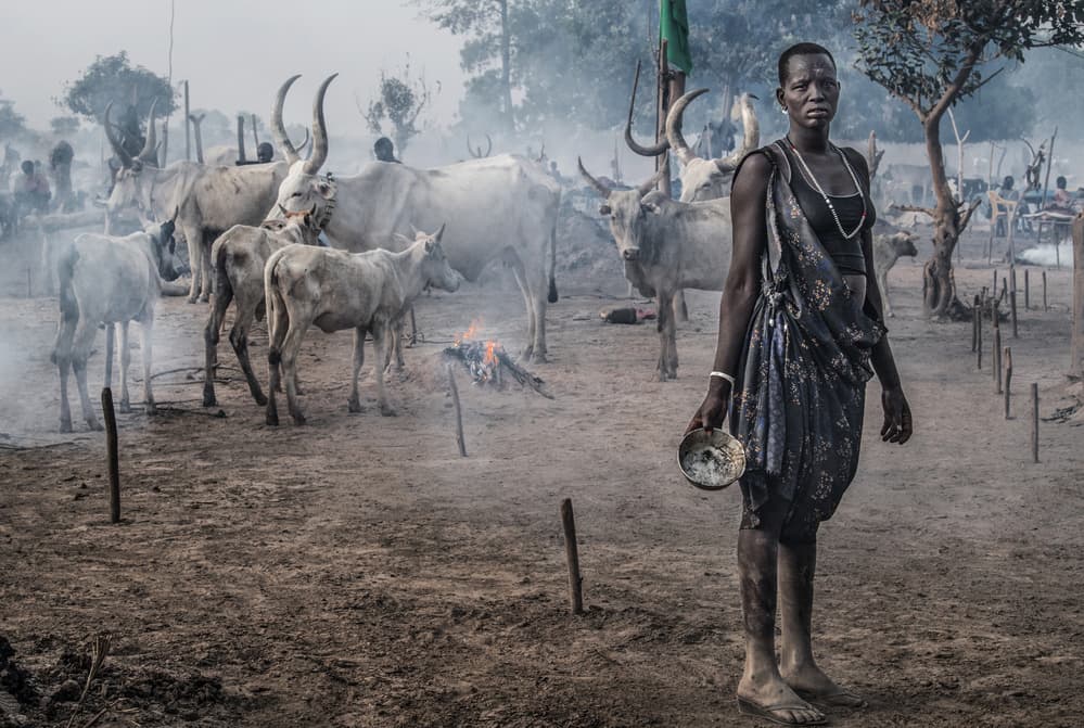 Dinka Woman Cattle Camp by Joxe Inazio Kuesta Garmendia — canvas wall art