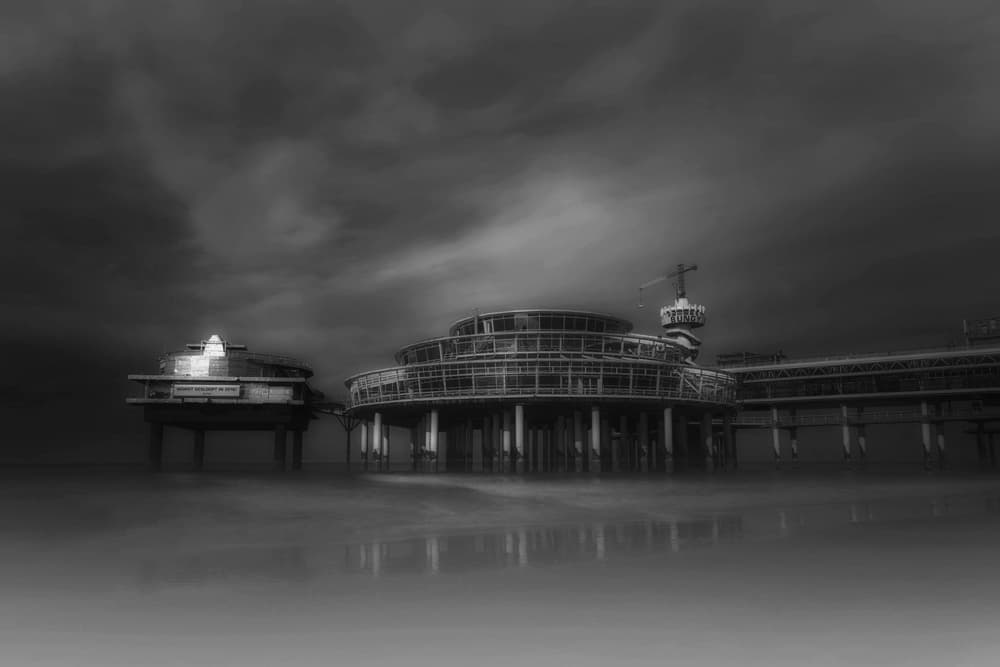 Moody Pier Seascape by Saskia Dingemans — canvas wall art
