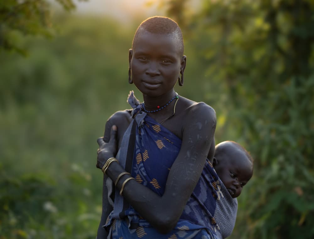 African Mother and Child by Hamza Qarooni — canvas wall art