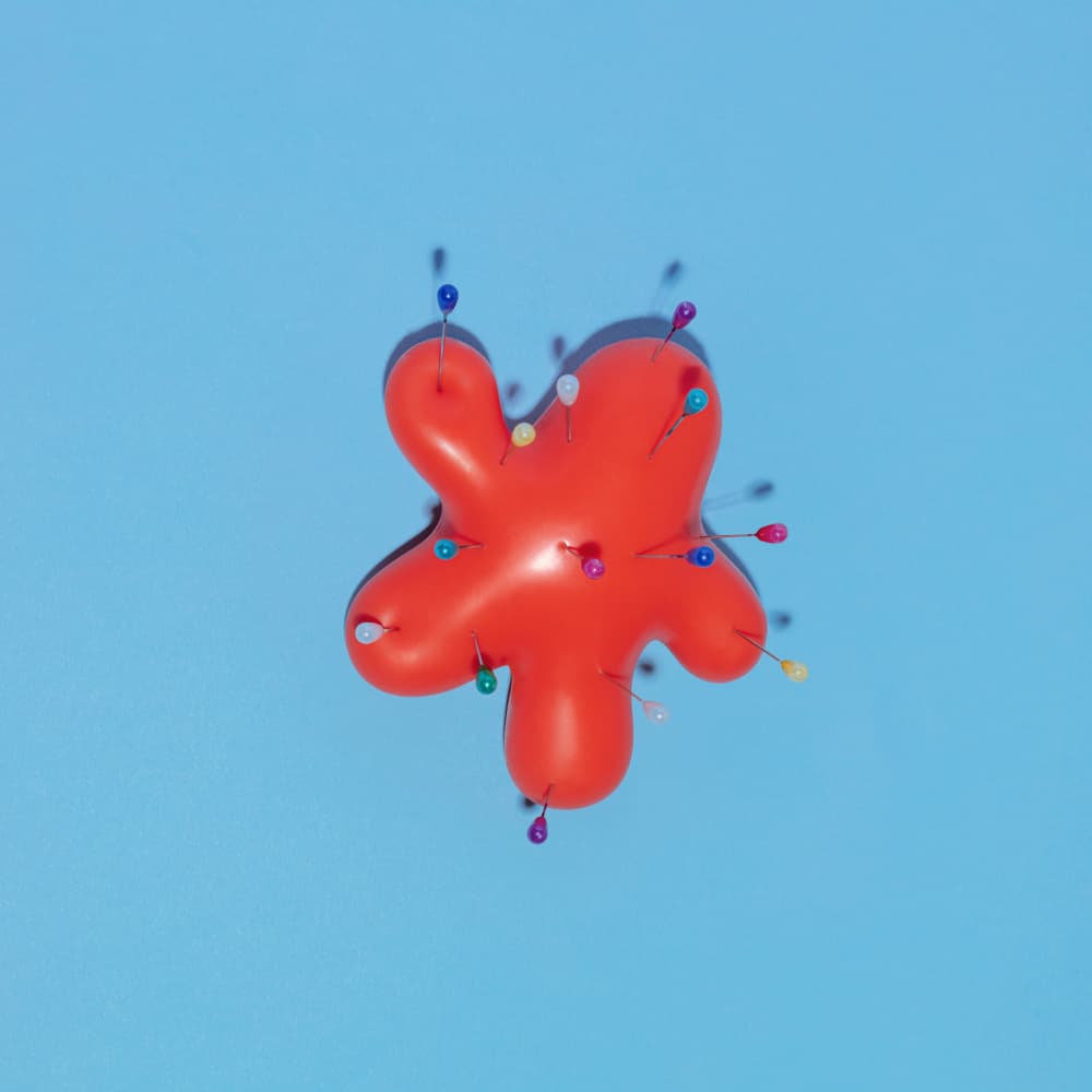 Pinned Red Stress Ball by Julia Ramiro — canvas wall art