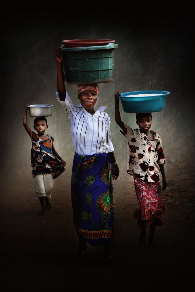 African Head Carriers by Antonio Grambone — canvas wall art