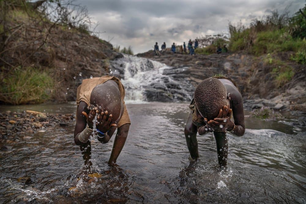 Washing By The Waterfall by Sarawut Intarob — canvas wall art