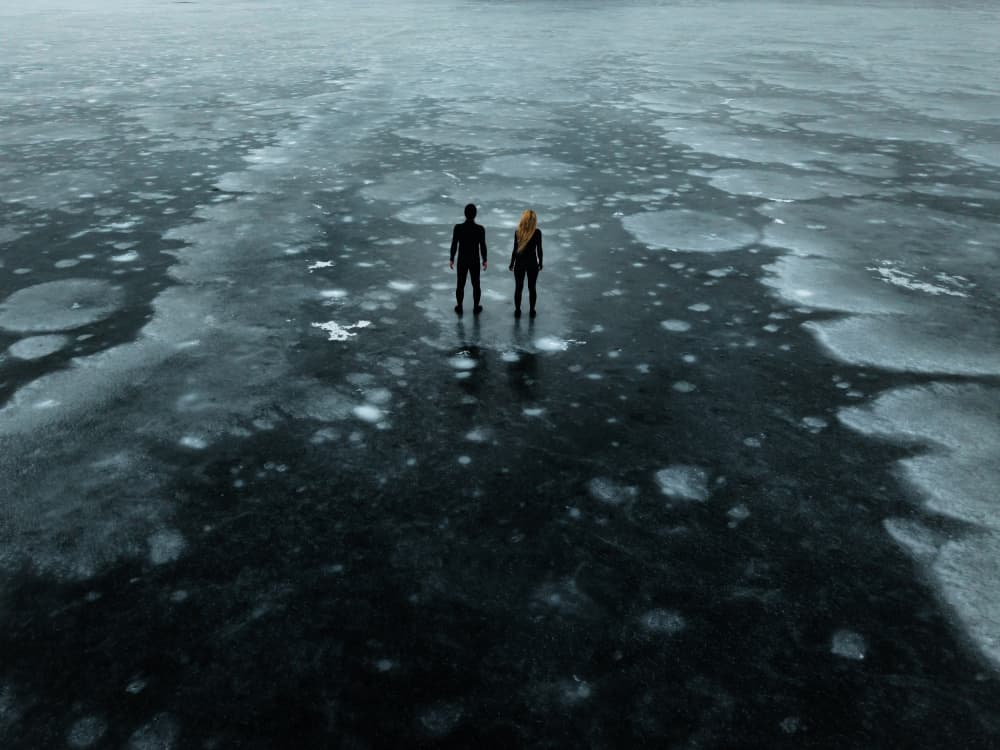 Couple on Frozen Lake by Leszek Paradowski — canvas wall art