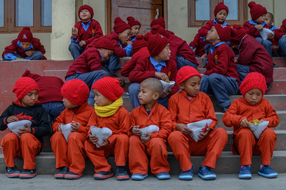 Young Monks On Steps by Ilana Lam — canvas wall art
