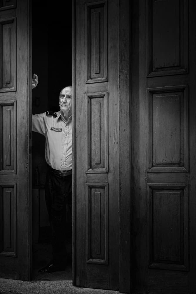 Old Man In Doorway by Steven Zhou — canvas wall art