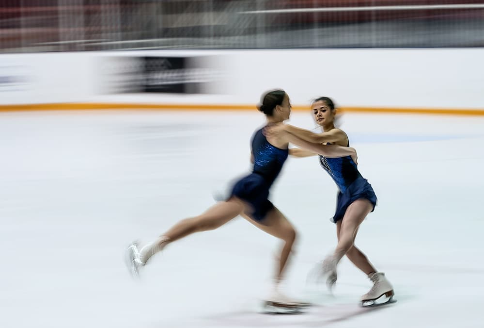 Dynamic Ice Skaters by Henry Zhao — canvas wall art