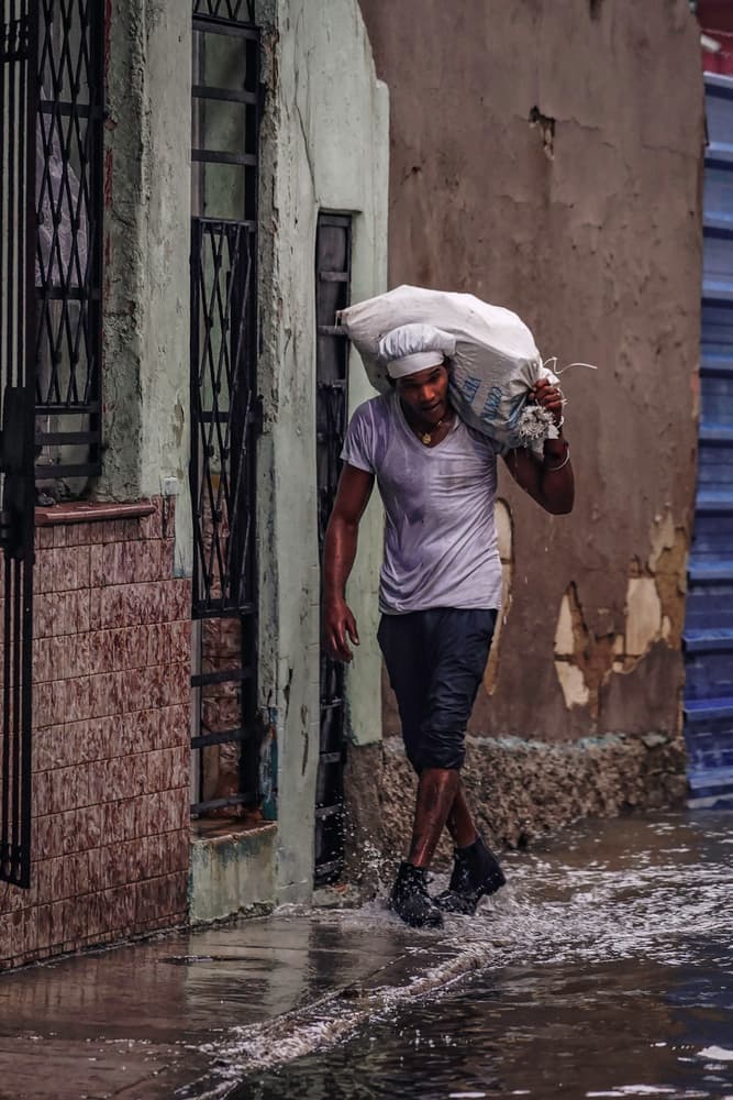 Man Walks Flooded Street by Andy Bauer — canvas wall art