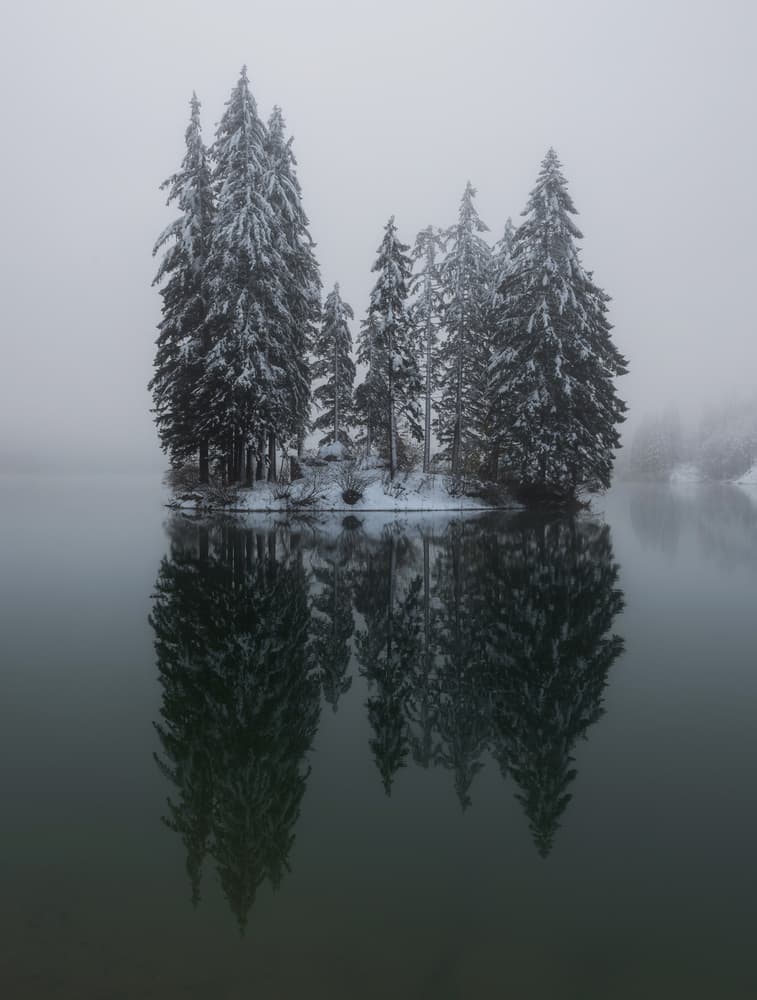 Snowy Island Reflection by Ales Krivec — canvas wall art