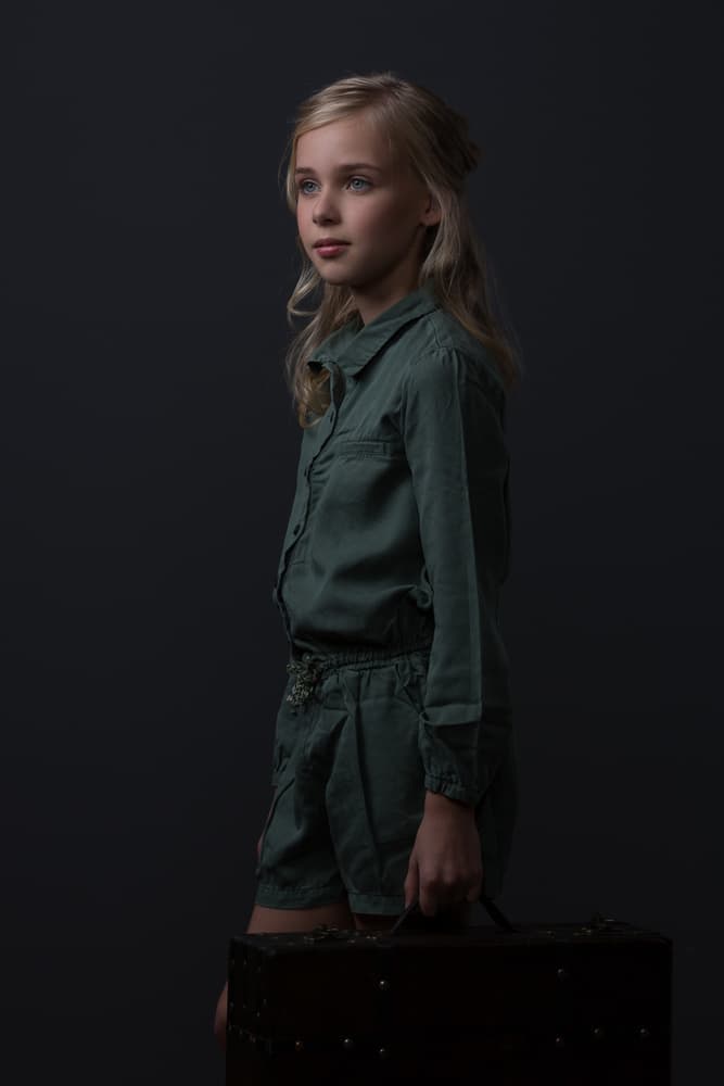 Young Traveler's Pensive Gaze by Carine Belzon — canvas wall art