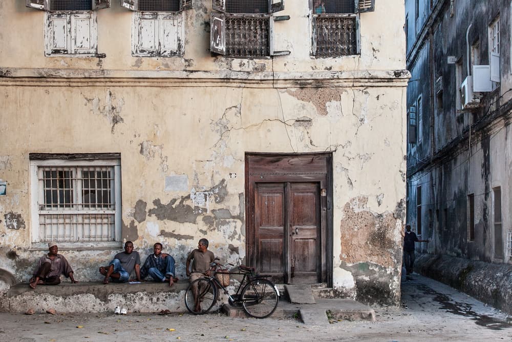 Stone Town Street Scene by Michel Guyot — canvas wall art