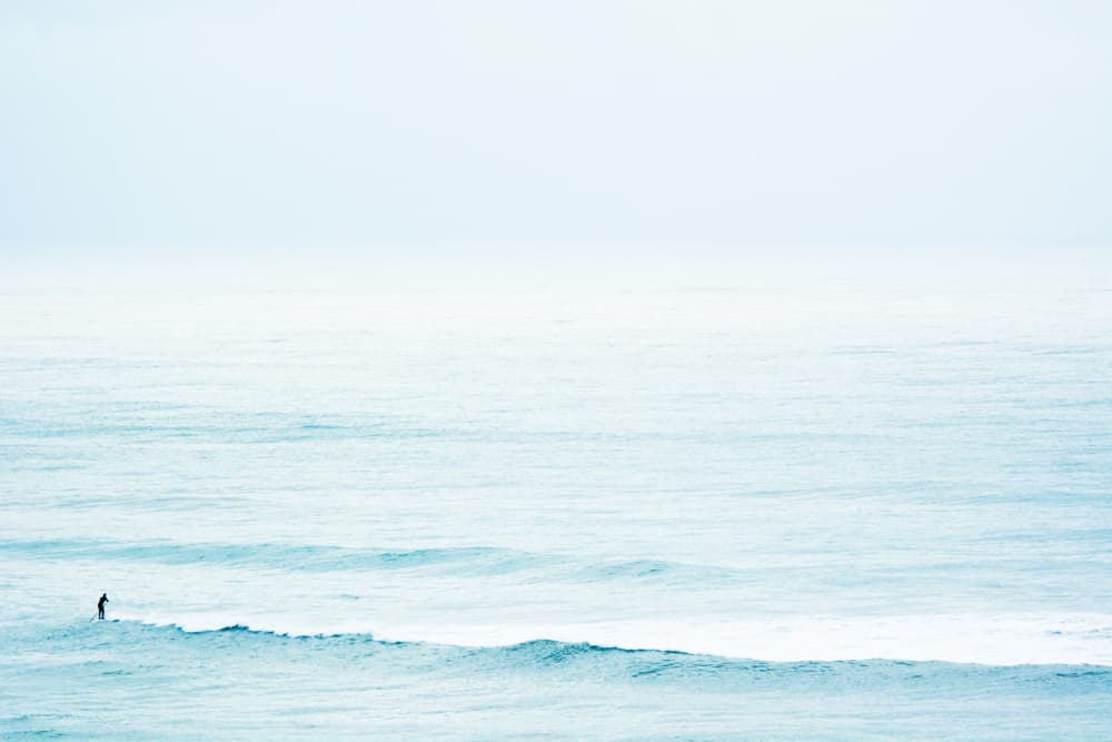 Lone Surfer Blue Ocean by Tal Paz-Fridman — canvas wall art